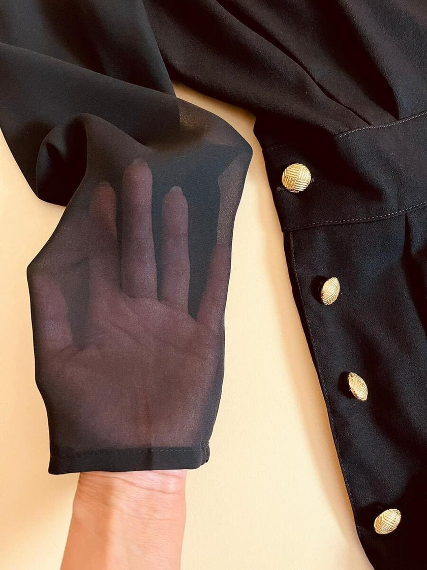 Smoking jumpsuit nera con bottoni dorati