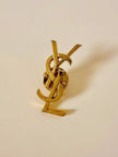 Spilla logo “Yves Saint Laurent”