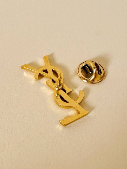 Spilla logo “Yves Saint Laurent”