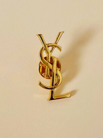 Spilla logo “Yves Saint Laurent”