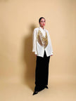 Top vintage a fazzoletto in maglia metallica dorata con lacci in pelle laminata oro