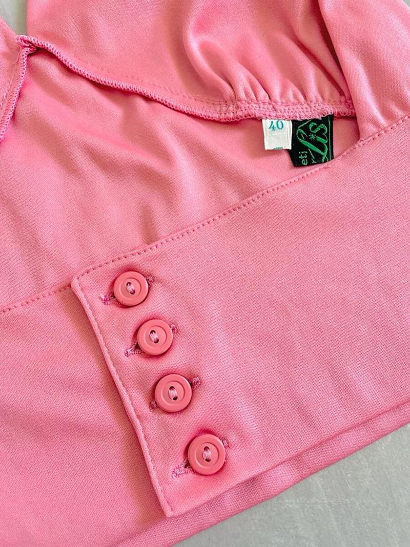 Top rosa con scollo all'americana