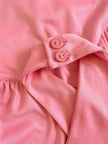 Top rosa con scollo all'americana