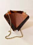 Bolso rígido Marie Antoinette de lucita con efecto carey y correa de cadena dorada
