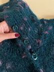 Cardigan in lana bouclé verde bottiglia con lavorazione bottonata multicolor