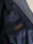 Bomber Yves Saint Laurent in lana grigio mélange con bottoni color cuoio