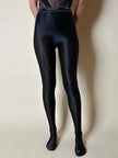 Collant vintage Yves Saint Laurent in lycra lucida nera con elastico logato