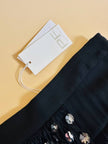 Abito/gonna in crepe di seta nero con frange a balze