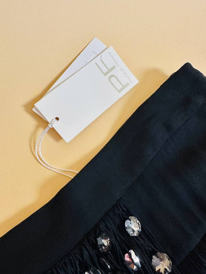 Abito/gonna in crepe di seta nero con frange a balze