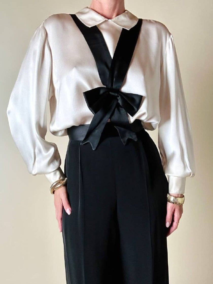 Pantalone nero con bretelle e maxi fiocchi in raso “Moschino Cheap and Chic”
