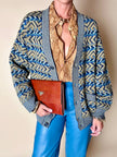 Cardigan Missoni Sport con pattern geometrico e trama tridimensionale nei toni del verde e blu