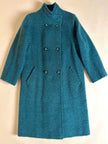 Cappotto doppiopetto in lana bouclé verde bosco con fodera firmata