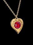 Collier vintage Yves Saint Laurent con ciondolo a forma di cuore firmato e cabochon rosso