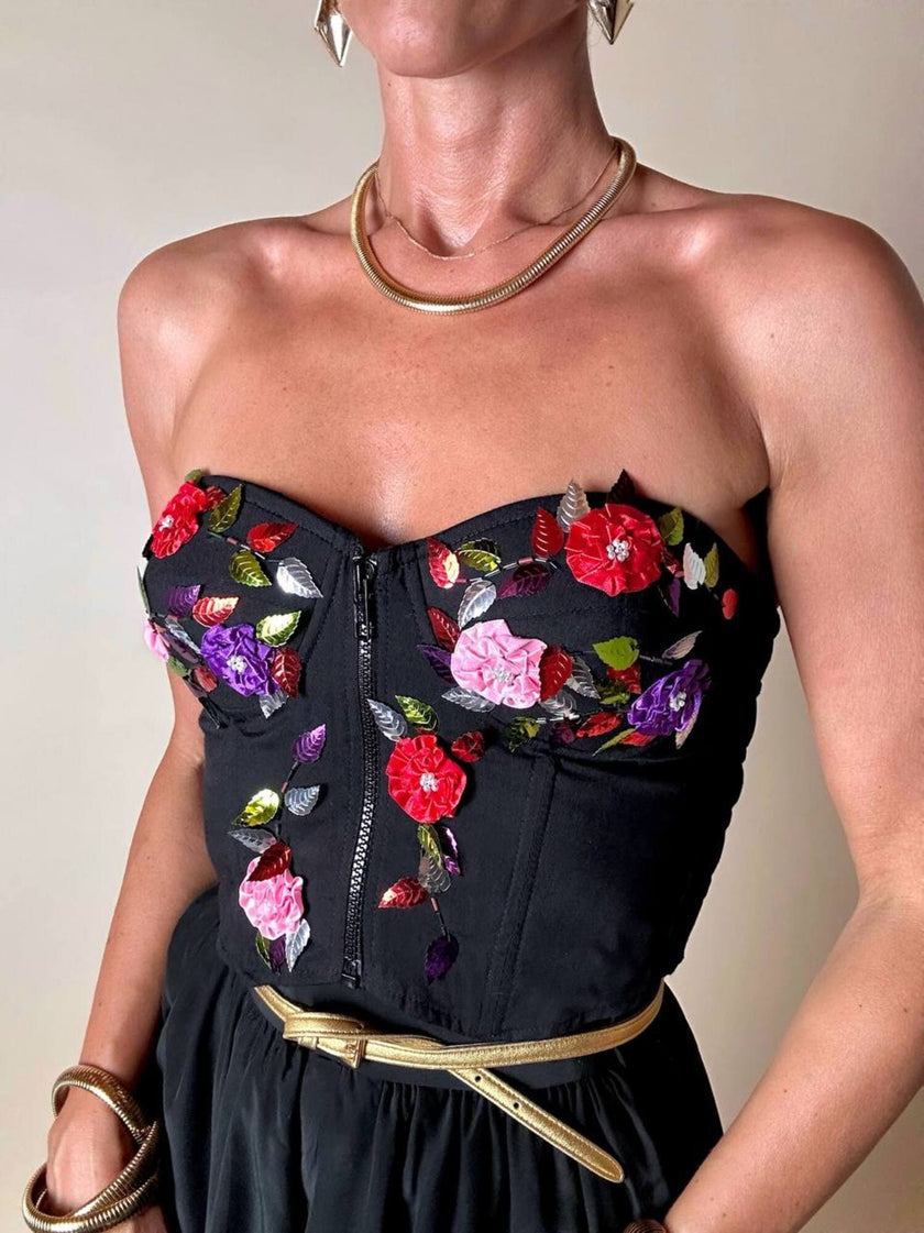 Bustier in cotone nero ricamato con fiori e paillettes e piccole coccarde multicolor “Giorgio Kauten”
