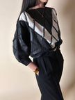 Blusa vintage in pelle nera e bianca patchwork con lavorazione crochet e maniche a pipistrello