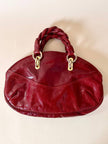 Borsa in pelle rosso bruciato con manici a treccia