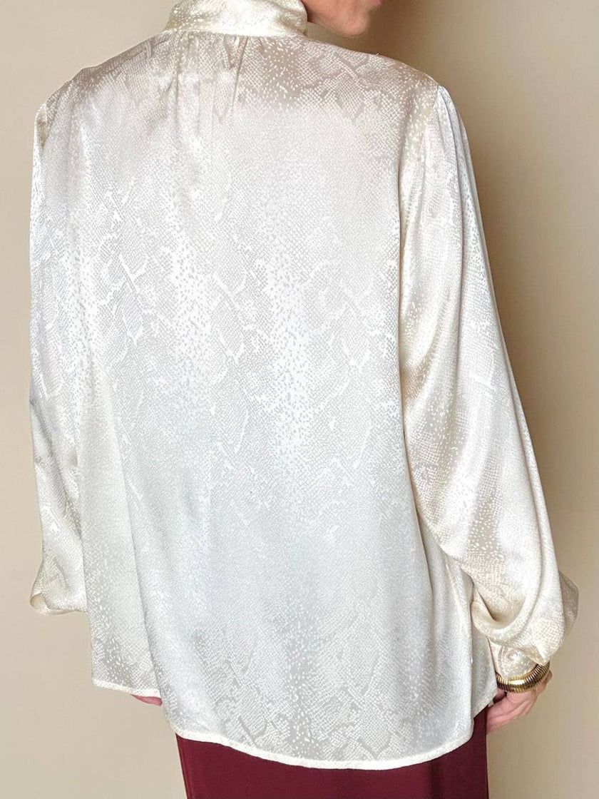 Blusa Yves Saint Laurent con fiocco al collo in seta jacquard avorio fantasia pitone