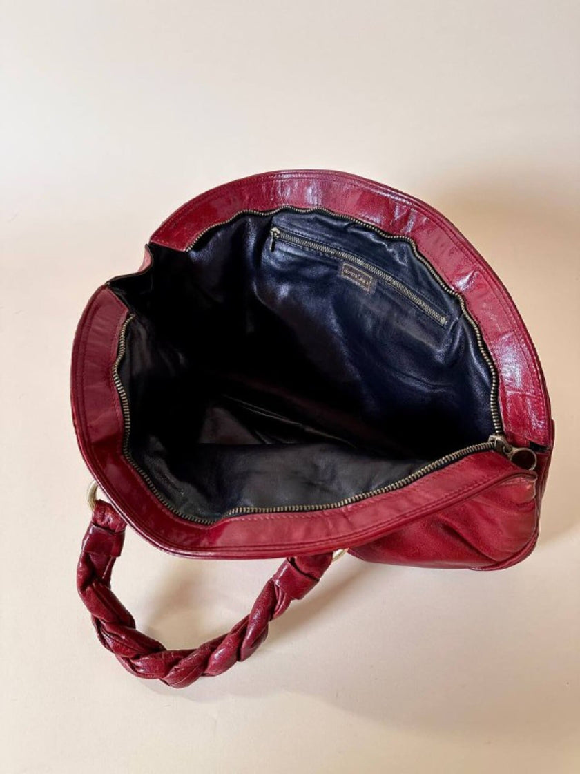 Borsa in pelle rosso bruciato con manici a treccia