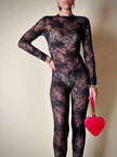 Jumpsuit con staffe in pizzo nero “La Perla”