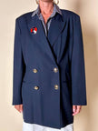 Spilla Yves Saint Laurent a forma di salvagente in metallo oro e smalto rosso e blu
