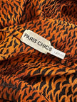 Camicia in pura seta con fiocco al collo e pattern micro rondini 