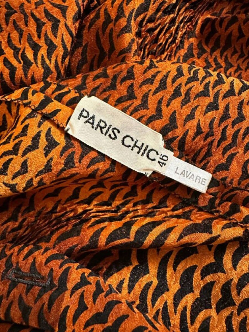 Camicia in pura seta con fiocco al collo e pattern micro rondini 