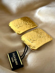 Maxi clip oro con logo “Yves Saint Laurent”