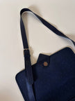 Borsa messenger in tessuto plastificato e pelle blu “Yves Saint Laurent”