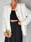Giacca vintage Yves Saint Laurent bianco latte con serpentine dorate e bottoni gioiello