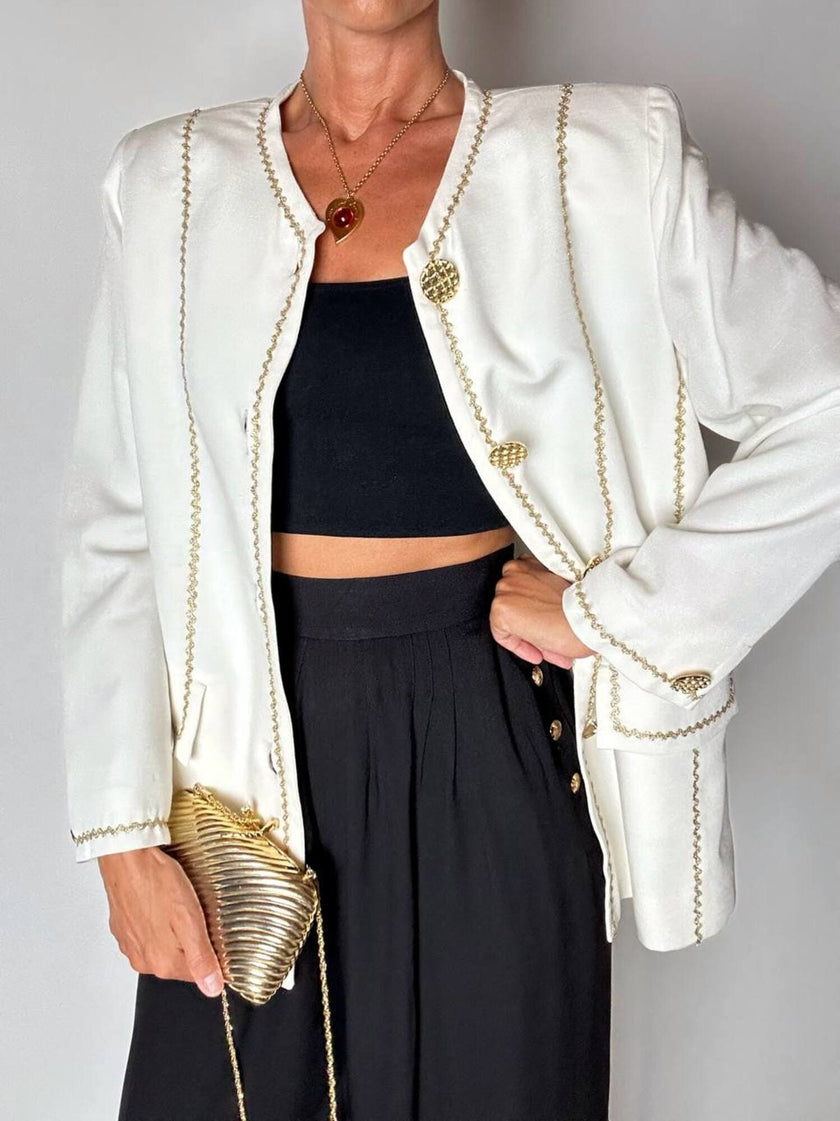 Giacca vintage Yves Saint Laurent bianco latte con serpentine dorate e bottoni gioiello