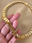 Collier dorato con moduli a onda