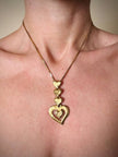 Collana dorata con ciondolo pendente a cuoricini “Yves Saint Laurent”