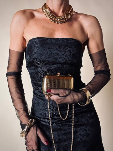 Mini clutch in metallo oro con tracolla in catena