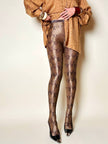 Collant Yves Saint Laurent in lycra fantasia pitone nei toni del beige bronzo e marrone