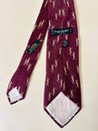 Cravatta Yves Saint Laurent in seta bordeaux con logo YSL beige allover