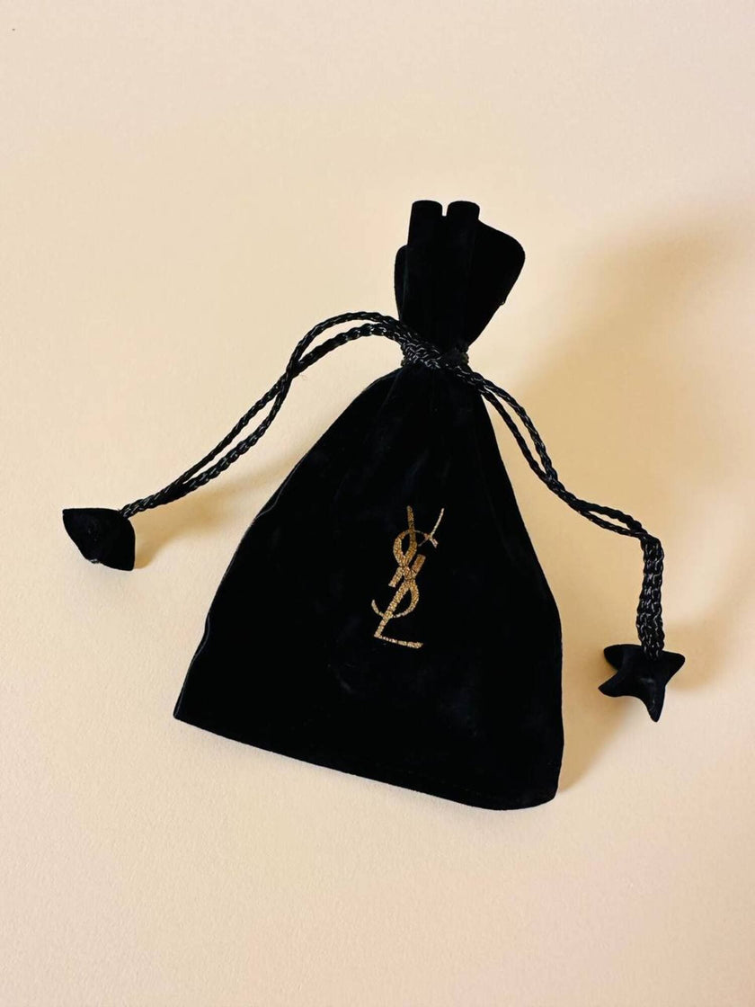 Orecchini a clip dorati a forma di capasanta “Yves Saint Laurent”