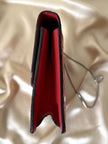 Borsa rossa in coccodrillo con borchie argento e tracolla metallica “Nicolette”