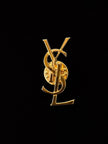 Vintage Yves Saint Laurent logo brooch in gold-tone metal