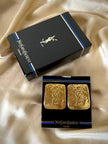 Maxi clip oro con logo “Yves Saint Laurent”