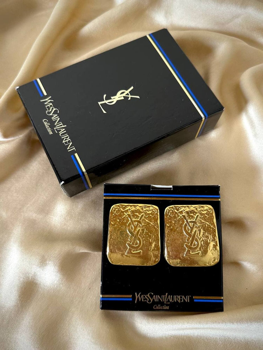 Maxi clip oro con logo “Yves Saint Laurent”
