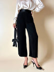 Pantalone nero con bretelle e maxi fiocchi in raso “Moschino Cheap and Chic”