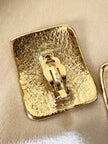 Maxi orecchini a clip dorati con logo YSL 