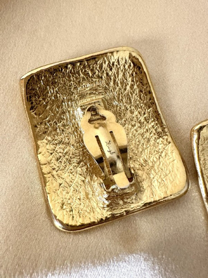 Maxi orecchini a clip dorati con logo YSL 