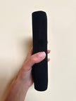 Mini pochette in tessuto nero con chiusura logata color oro “Gucci”