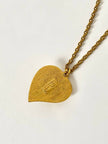 Collier vintage Yves Saint Laurent con ciondolo a forma di cuore firmato e cabochon rosso