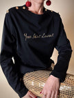 Maglia in cotone nero con bottoni dorati “Yves Saint Laurent”