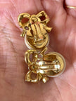 Clip con perle cabochon e piccoli fiocchi incastonati con strass “Nina Ricci”