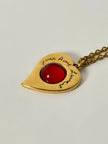 Collier vintage Yves Saint Laurent con ciondolo a forma di cuore firmato e cabochon rosso