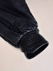 Bomber fatto a mano in pelle nera con maxi collo in mongolia
