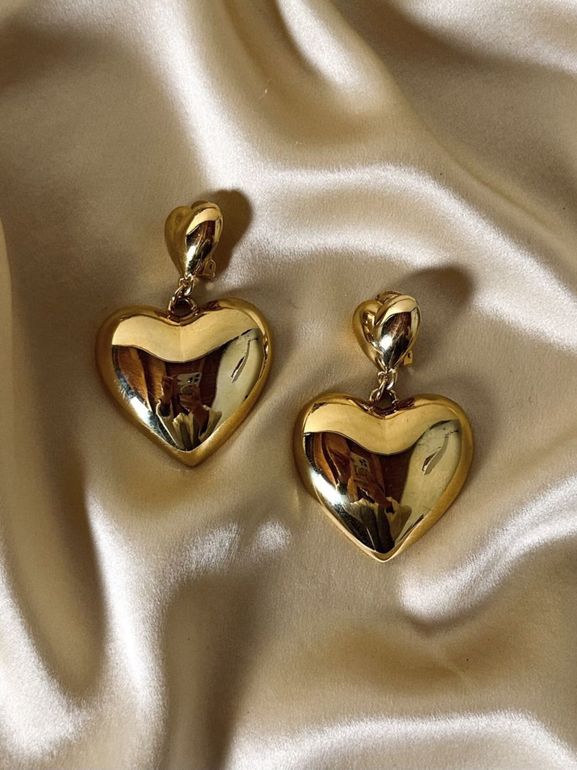 Maxi clip oro con cuori pendenti “Moschino”
